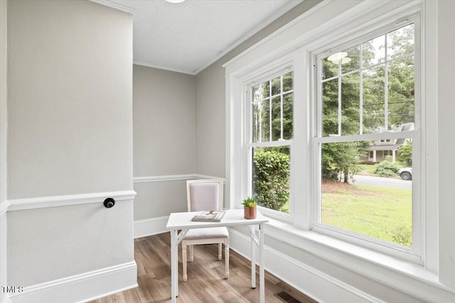 205 Forest Hill Ave, Rocky Mount, NC 27804 - living area featuring baseboards, an office area, crown molding, wood finished floors, and a textured ceiling
