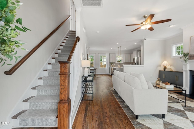 415 Dupree St, Durham, NC 27707 - living room with stairs, healthy amount of natural light, ornamental molding, a ceiling fan, and recessed lighting