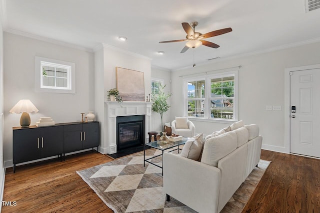 415 Dupree St, Durham, NC 27707 - living area featuring wood finished floors, ceiling fan, crown molding, a fireplace with flush hearth, and baseboards