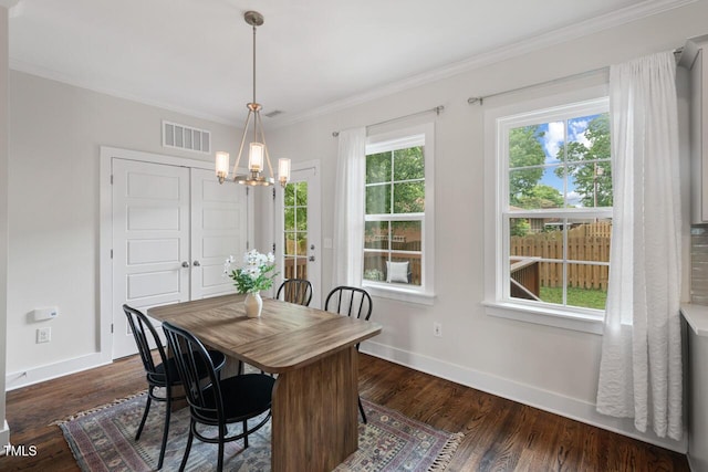415 Dupree St, Durham, NC 27707 - dining room featuring a chandelier, baseboards, ornamental molding, and dark wood-type flooring
