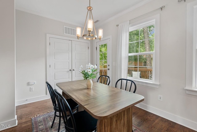415 Dupree St, Durham, NC 27707 - dining space featuring a chandelier, crown molding, baseboards, and dark wood-style floors