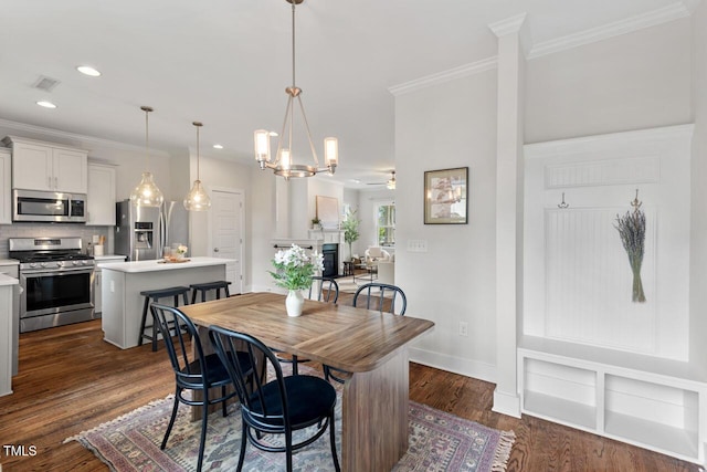 415 Dupree St, Durham, NC 27707 - dining area featuring recessed lighting, crown molding, dark wood finished floors, and baseboards