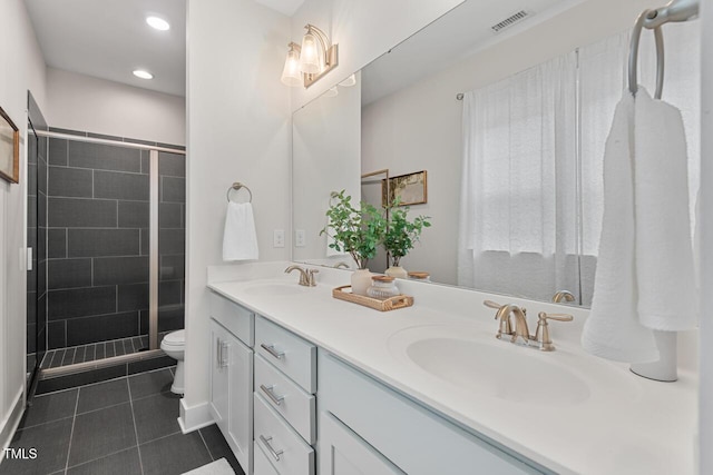 415 Dupree St, Durham, NC 27707 - full bathroom featuring double vanity, tile patterned floors, toilet, a stall shower, and recessed lighting