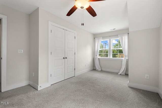 415 Dupree St, Durham, NC 27707 - unfurnished bedroom featuring carpet, baseboards, a closet, and ceiling fan