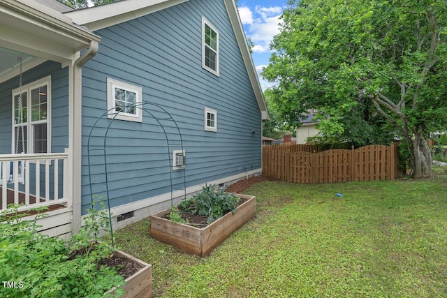 415 Dupree St, Durham, NC 27707 - view of side of home with a vegetable garden and crawl space