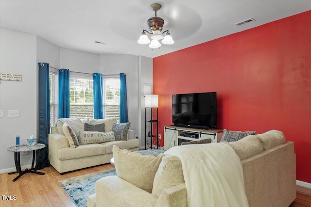 300 Gilman Ln Unit 101, Raleigh, NC 27610 - living room with a ceiling fan, wood finished floors, and baseboards