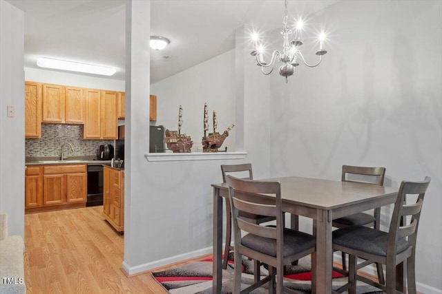 300 Gilman Ln Unit 101, Raleigh, NC 27610 - dining space with light wood-style floors and a chandelier
