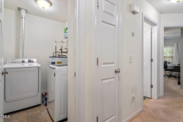 300 Gilman Ln Unit 101, Raleigh, NC 27610 - laundry area with washing machine and clothes dryer, carpet floors, and water heater