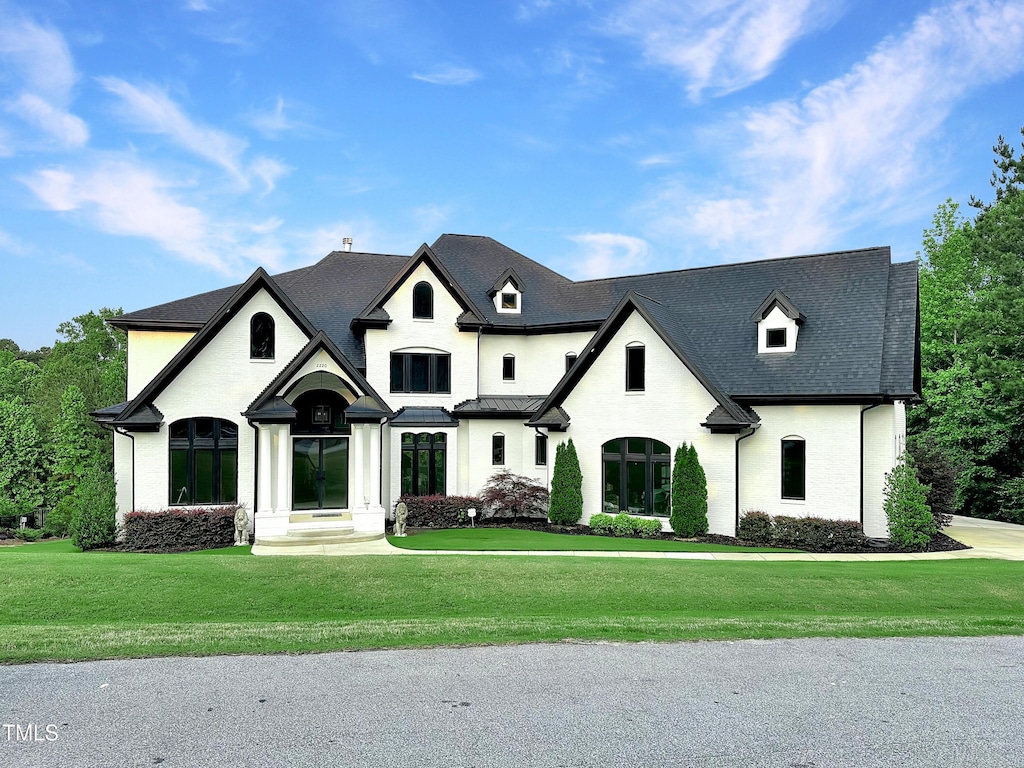 2220 Inwood Landing Ct, Raleigh, NC 27603 - french country inspired facade featuring a front yard