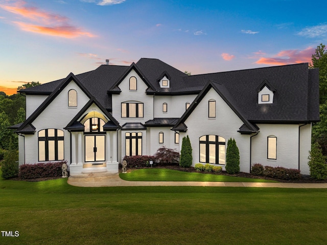 2220 Inwood Landing Ct, Raleigh, NC 27603 - french country inspired facade featuring a front lawn, french doors, and roof with shingles