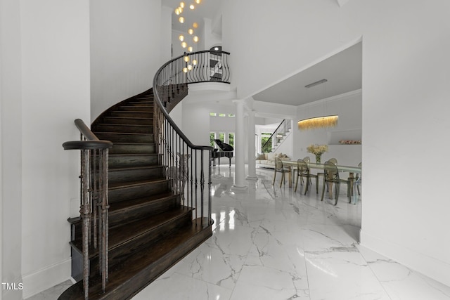 2220 Inwood Landing Ct, Raleigh, NC 27603 - stairway with ornate columns, marble tiled floors, baseboards, and a high ceiling