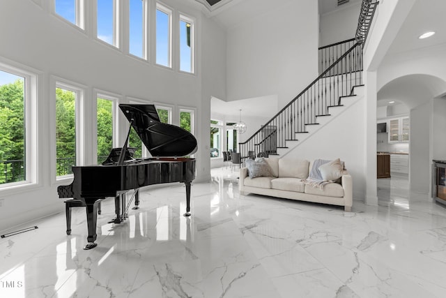 2220 Inwood Landing Ct, Raleigh, NC 27603 - foyer entrance with plenty of natural light, a high ceiling, marble tiled flooring, and stairway