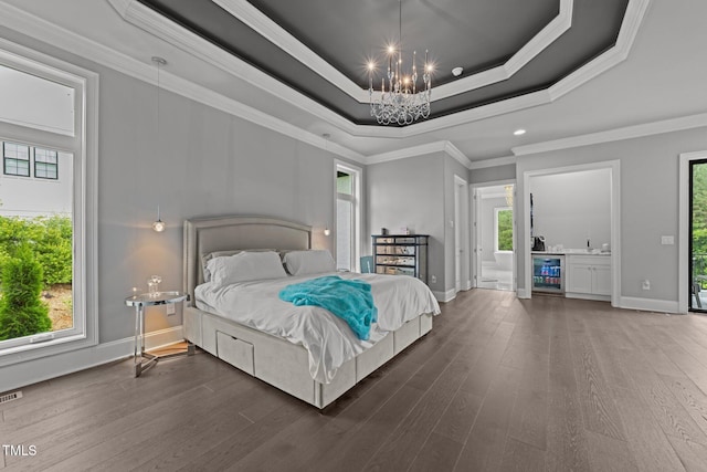 2220 Inwood Landing Ct, Raleigh, NC 27603 - bedroom with beverage cooler, a chandelier, wood finished floors, baseboards, and a raised ceiling