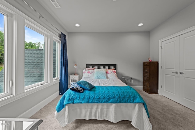 2220 Inwood Landing Ct, Raleigh, NC 27603 - carpeted bedroom with multiple windows, baseboards, recessed lighting, and a closet