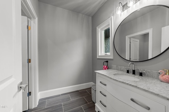 2220 Inwood Landing Ct, Raleigh, NC 27603 - bathroom with baseboards, vanity, and wood tiled floors