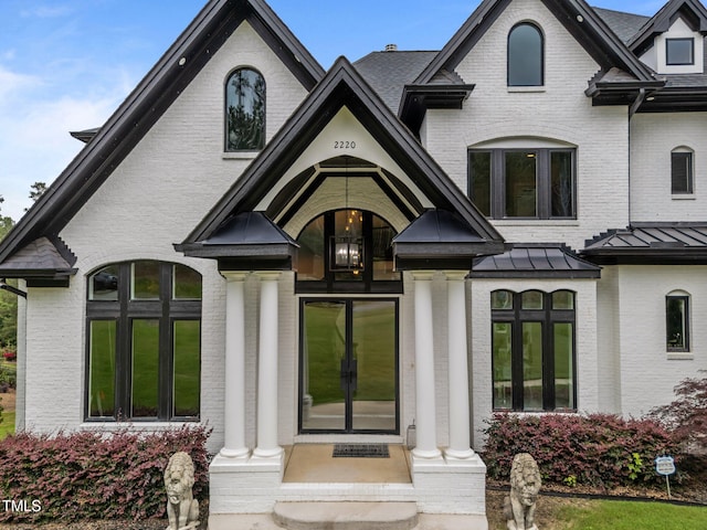 2220 Inwood Landing Ct, Raleigh, NC 27603 - view of front facade featuring brick siding and a standing seam roof