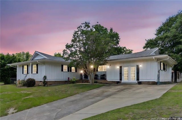 1926 Martindale Dr, Fayetteville, NC 28304 - ranch-style home featuring french doors, board and batten siding, and a yard