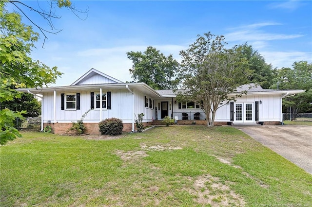 1926 Martindale Dr, Fayetteville, NC 28304 - single story home featuring board and batten siding, a front lawn, french doors, and a porch