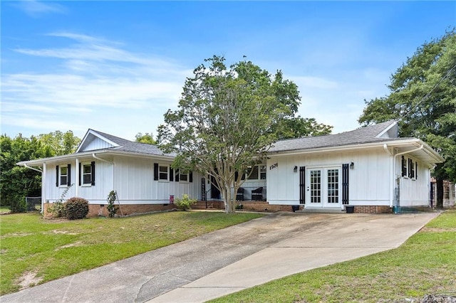 1926 Martindale Dr, Fayetteville, NC 28304 - ranch-style house featuring french doors, board and batten siding, and a front yard