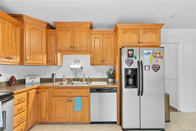 1926 Martindale Dr, Fayetteville, NC 28304 - kitchen with appliances with stainless steel finishes, a sink, and light tile patterned floors