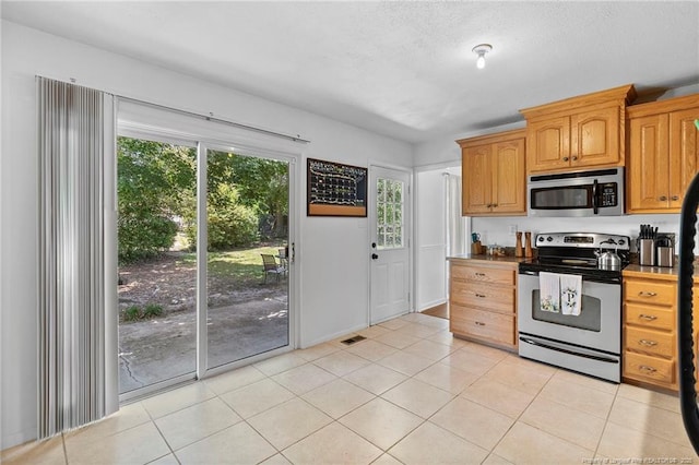 1926 Martindale Dr, Fayetteville, NC 28304 - kitchen featuring appliances with stainless steel finishes and light tile patterned floors
