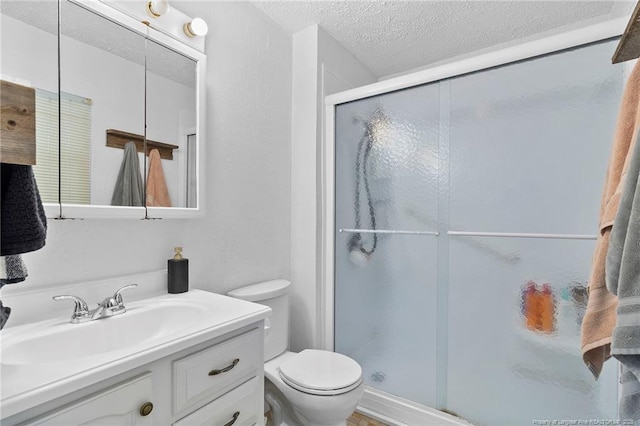 1926 Martindale Dr, Fayetteville, NC 28304 - bathroom with toilet, vanity, a textured ceiling, and a shower stall