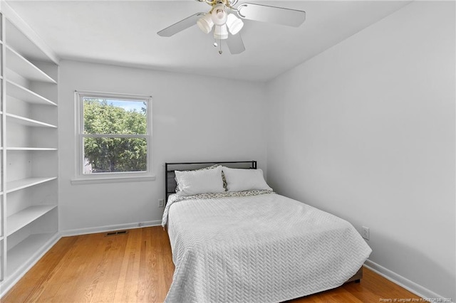 1926 Martindale Dr, Fayetteville, NC 28304 - bedroom featuring wood finished floors, ceiling fan, and baseboards