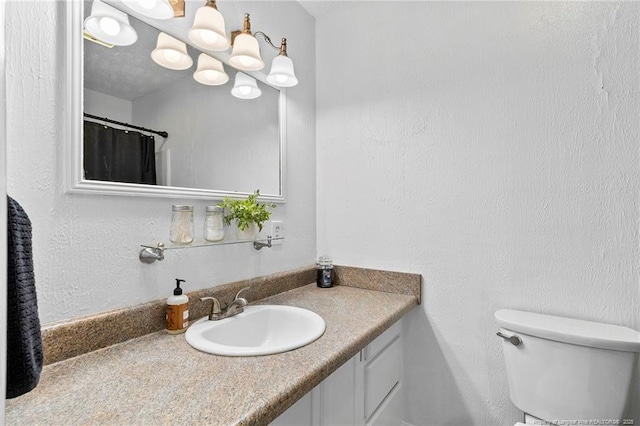 1926 Martindale Dr, Fayetteville, NC 28304 - bathroom with vanity, toilet, and a chandelier