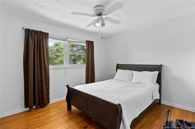 1926 Martindale Dr, Fayetteville, NC 28304 - bedroom featuring wood finished floors, baseboards, and ceiling fan