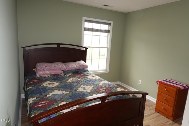 114 Calebra Way, Cary, NC 27519 - bedroom with baseboards and light wood-type flooring
