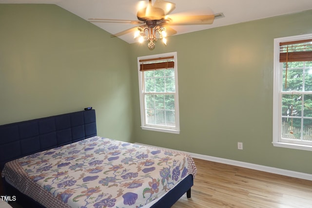 114 Calebra Way, Cary, NC 27519 - bedroom with wood finished floors, lofted ceiling, baseboards, and a ceiling fan