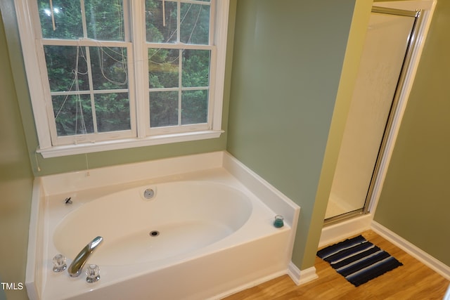 114 Calebra Way, Cary, NC 27519 - bathroom with a garden tub, a shower stall, and wood finished floors