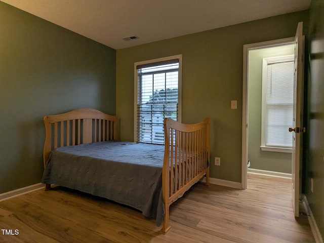 114 Calebra Way, Cary, NC 27519 - bedroom featuring wood finished floors and baseboards
