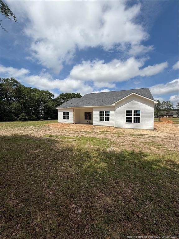 3649 Quarter Horse Run, Parkton, NC 28371 - back of house with a lawn
