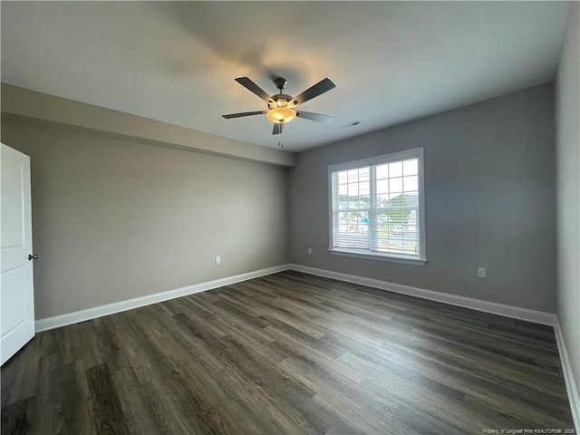 240 Gallery Dr Unit 301, Spring Lake, NC 28390 - spare room featuring dark wood-style flooring, baseboards, and a ceiling fan