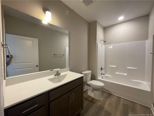 240 Gallery Dr Unit 301, Spring Lake, NC 28390 - full bathroom featuring wood finished floors, toilet, vanity, and shower / bath combination
