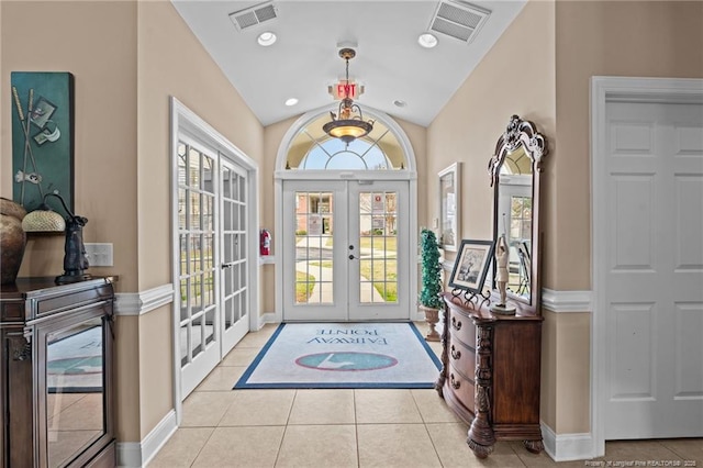 240 Gallery Dr Unit 301, Spring Lake, NC 28390 - foyer featuring french doors, tile patterned floors, lofted ceiling, and baseboards