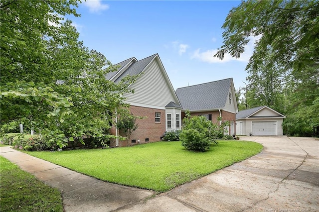 5387 Clubhouse Ln, Hope Mills, NC 28348 - view of property exterior featuring an outbuilding, brick siding, a lawn, concrete driveway, and crawl space