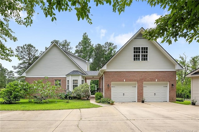 5387 Clubhouse Ln, Hope Mills, NC 28348 - view of front of home featuring brick siding, driveway, and a garage
