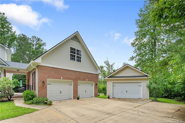 5387 Clubhouse Ln, Hope Mills, NC 28348 - view of side of property featuring brick siding and a detached garage