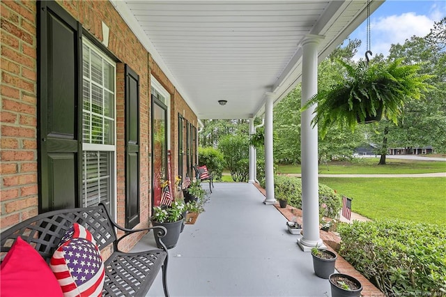5387 Clubhouse Ln, Hope Mills, NC 28348 - porch featuring a lawn
