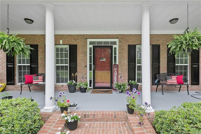 5387 Clubhouse Ln, Hope Mills, NC 28348 - view of exterior entry with a porch and brick siding