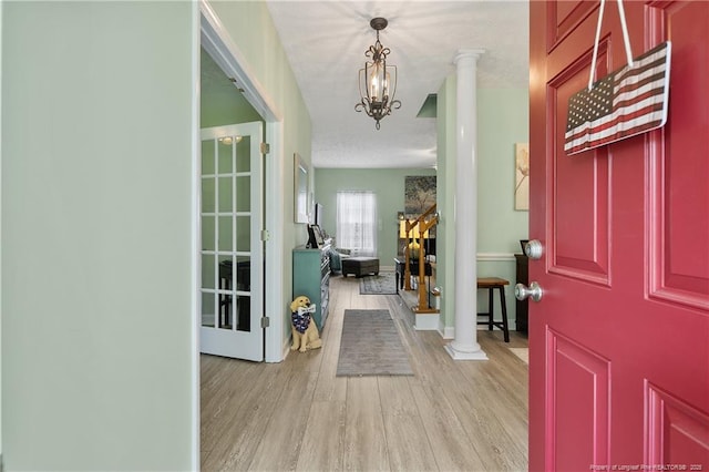 5387 Clubhouse Ln, Hope Mills, NC 28348 - foyer with light wood-style floors and decorative columns