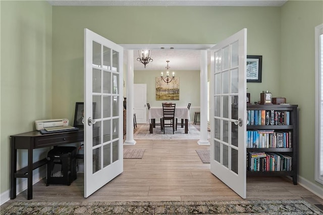 5387 Clubhouse Ln, Hope Mills, NC 28348 - entryway featuring french doors, a chandelier, wood finished floors, and baseboards