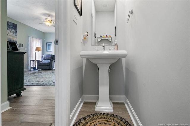 5387 Clubhouse Ln, Hope Mills, NC 28348 - bathroom with a ceiling fan, wood finished floors, and baseboards