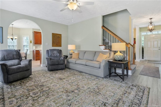 5387 Clubhouse Ln, Hope Mills, NC 28348 - living room featuring a ceiling fan, a chandelier, and plenty of natural light