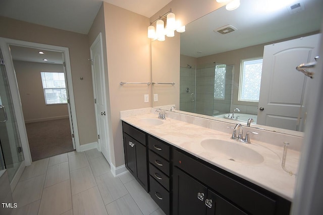 4416 Walker Hallow St, Raleigh, NC 27616 - full bathroom with a shower stall, double vanity, healthy amount of natural light, and a garden tub