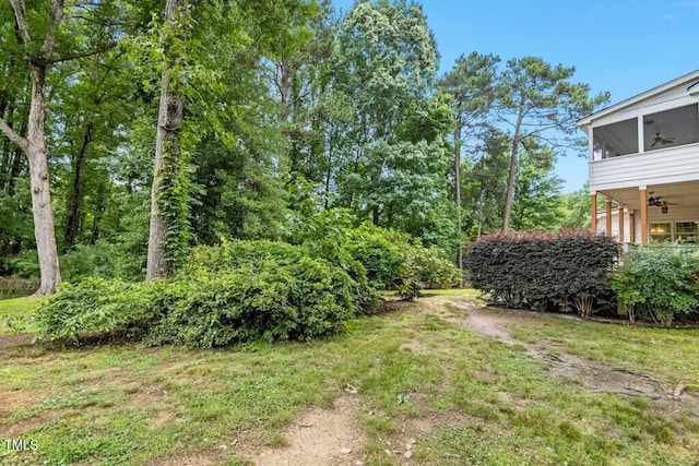 9509 Greenfield Dr, Raleigh, NC 27615 - view of grassy yard with a sunroom and a ceiling fan