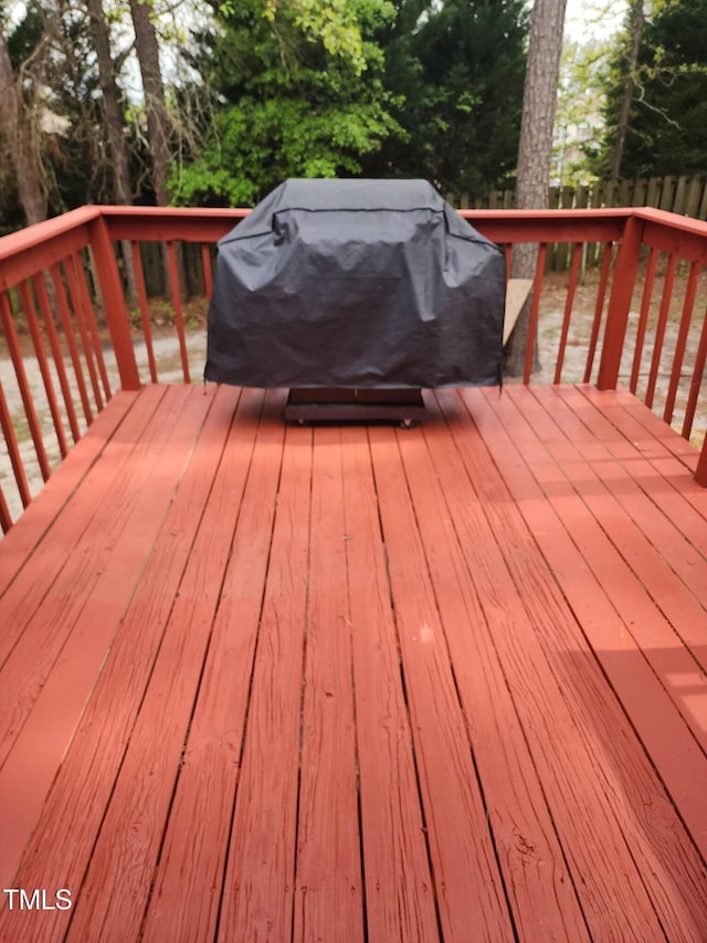 6905 Pine Creek Ct, Fayetteville, NC 28314 - wooden terrace featuring view of wooded area and area for grilling