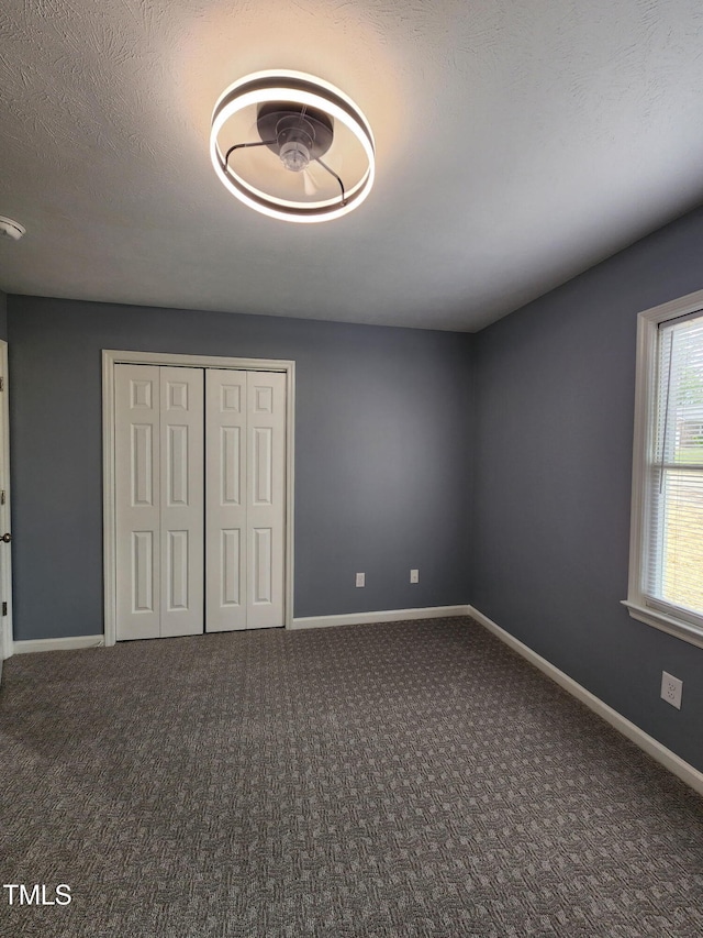 6905 Pine Creek Ct, Fayetteville, NC 28314 - unfurnished bedroom with carpet, a closet, and baseboards
